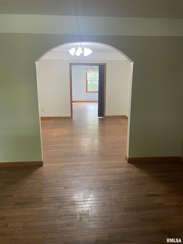 5833 Taylor St, Davenport, IA 52806 - unfurnished room featuring hardwood / wood-style floors, a chandelier, baseboards, and a textured ceiling