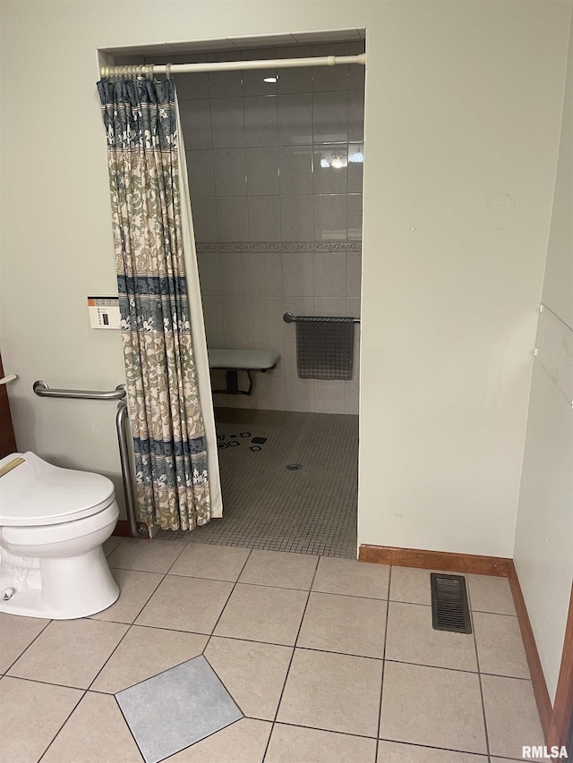 5833 Taylor St, Davenport, IA 52806 - full bath featuring tile patterned floors, tiled shower, and toilet