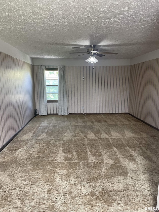 5833 Taylor St, Davenport, IA 52806 - unfurnished room featuring carpet, a ceiling fan, and a textured ceiling