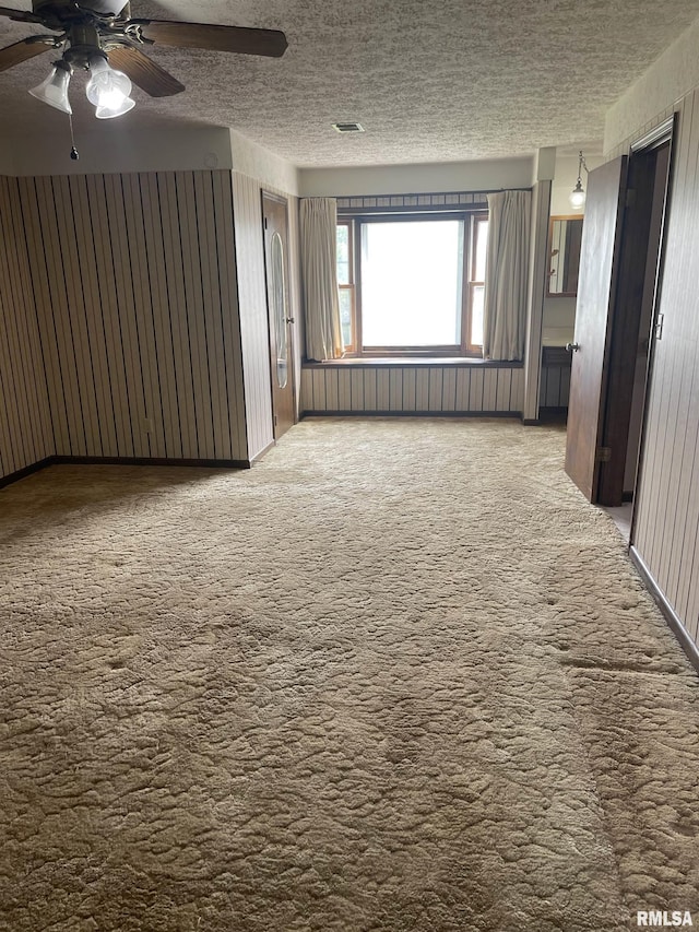 5833 Taylor St, Davenport, IA 52806 - carpeted spare room with a textured ceiling and ceiling fan