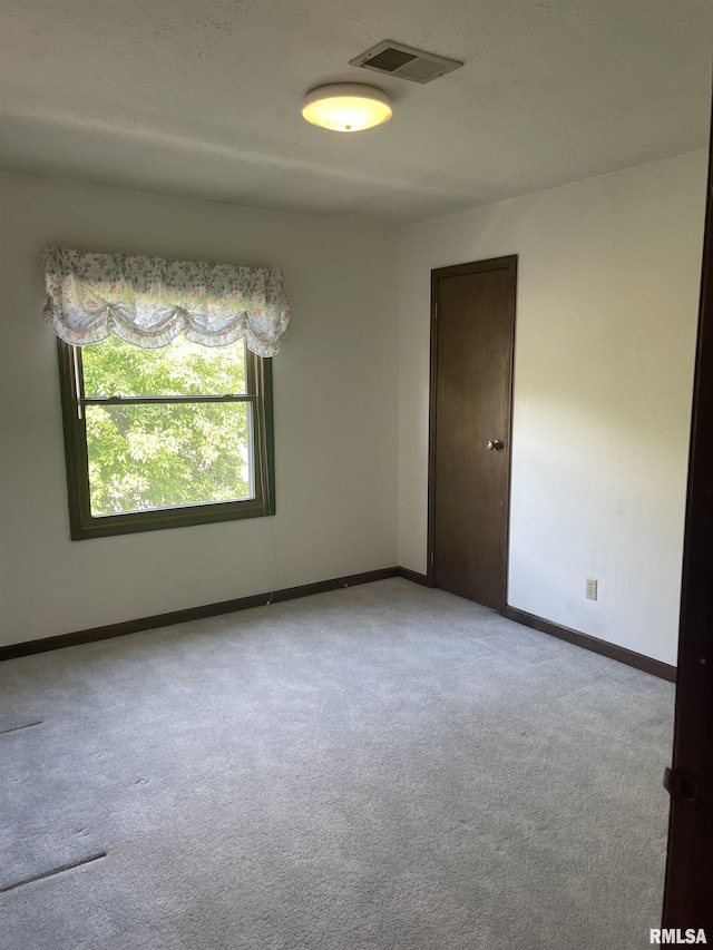 5833 Taylor St, Davenport, IA 52806 - spare room with carpet and baseboards