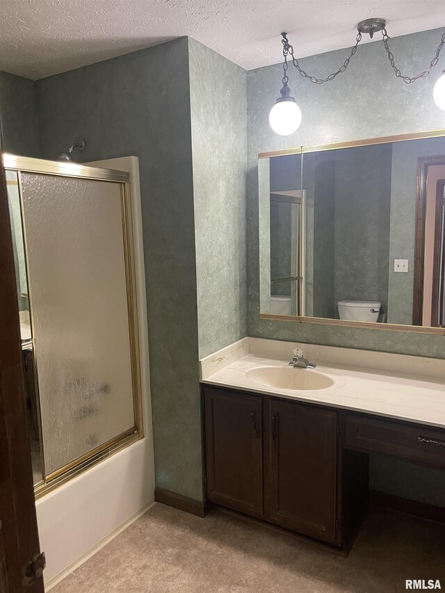5833 Taylor St, Davenport, IA 52806 - full bath featuring a textured ceiling, vanity, shower / bath combination with glass door, and toilet