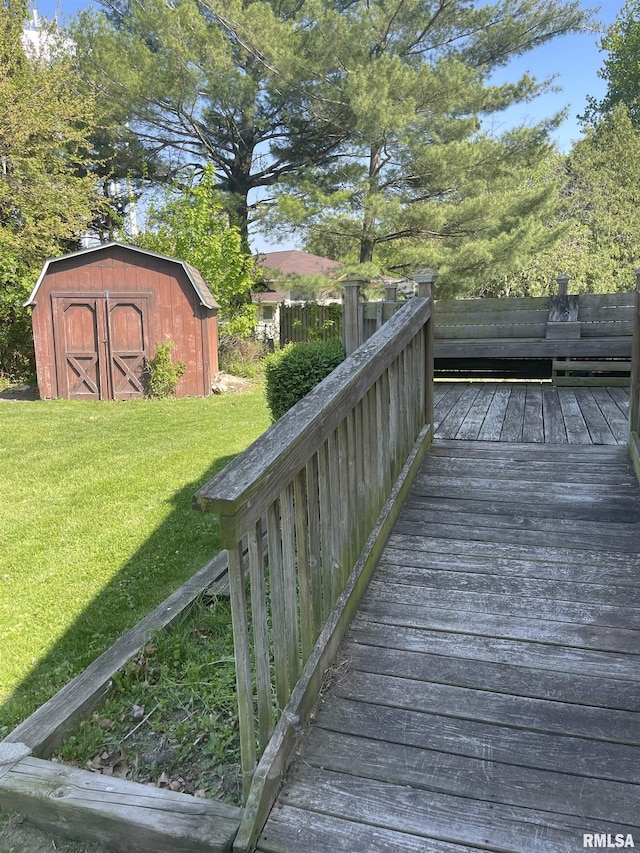 5833 Taylor St, Davenport, IA 52806 - wooden deck featuring a shed, a yard, and an outbuilding