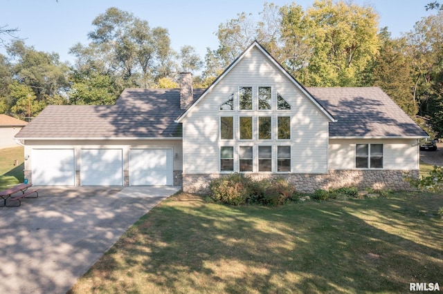 view of front of property featuring a front lawn, driveway, stone siding, a chimney, and a garage