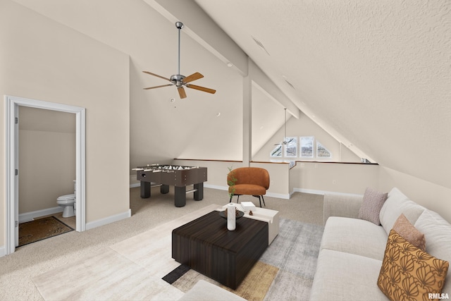 carpeted living area featuring vaulted ceiling, a textured ceiling, baseboards, and ceiling fan
