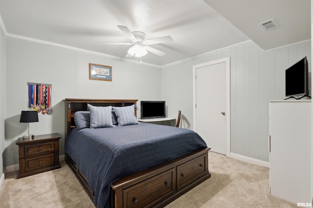bedroom with ornamental molding, light carpet, and visible vents