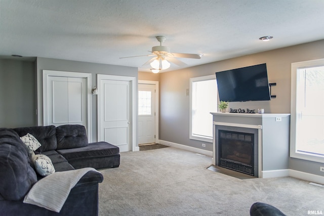 1724 E 1324th St, Fowler, IL 62338 - living area with a fireplace with flush hearth, baseboards, carpet, and ceiling fan
