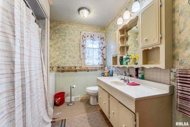 bathroom featuring wallpapered walls, vanity, a shower with curtain, toilet, and visible vents