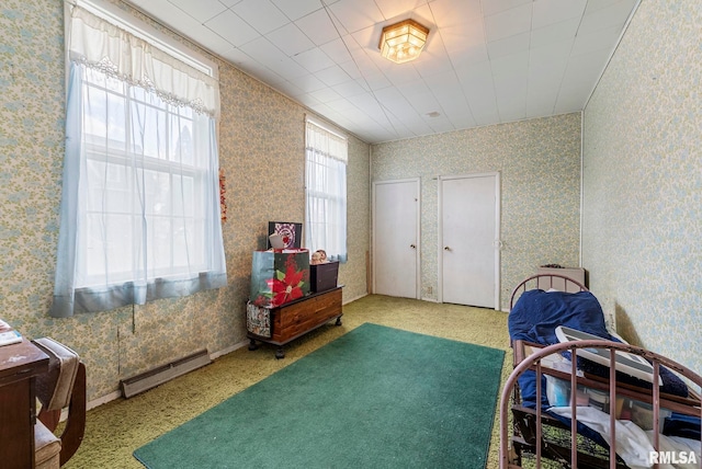 interior space featuring baseboard heating and wallpapered walls