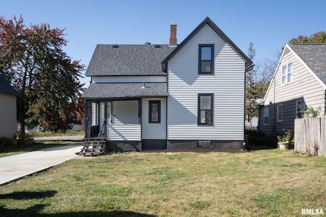 2129 Washington St, Davenport, IA 52804 - back of house with a lawn, a chimney, and roof with shingles