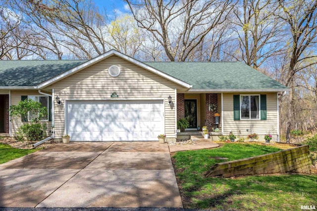 ranch-style home with an attached garage, roof with shingles, driveway, and a front lawn