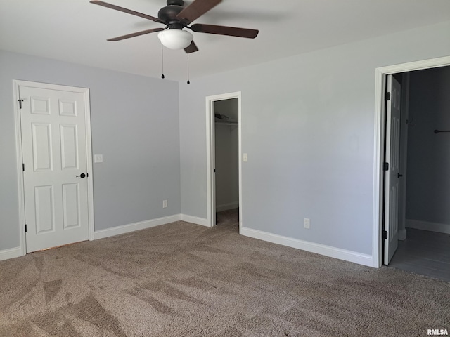 507 Timothy Ln, Galatia, IL 62935 - unfurnished bedroom with a walk in closet, carpet, and baseboards