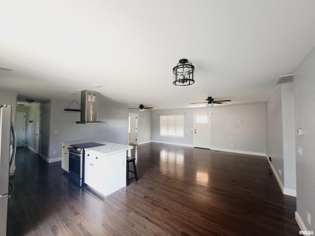 507 Timothy Ln, Galatia, IL 62935 - kitchen with wall chimney exhaust hood, baseboards, ceiling fan, and electric range