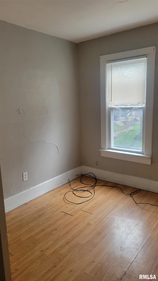 1306 Davie St, Davenport, IA 52804 - empty room featuring wood finished floors