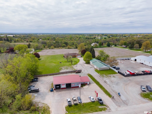 birds eye view of property with a wooded view