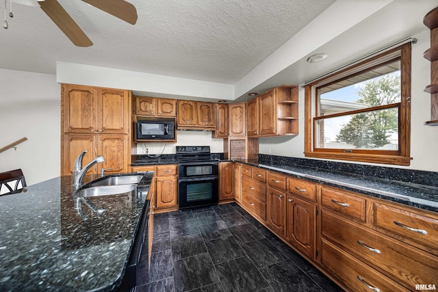 kitchen featuring open shelves, brown cabinetry, black appliances, and a sink