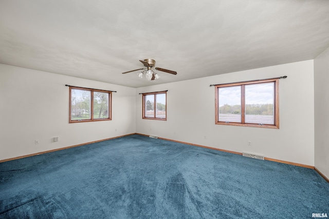 spare room featuring ceiling fan, carpet, baseboards, and visible vents