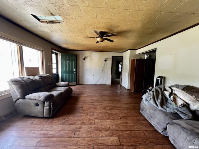 57 W 3rd St, New Burnside, IL 62967 - living area featuring wood-type flooring, visible vents, and ceiling fan