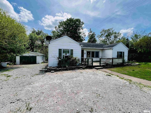 57 W 3rd St, New Burnside, IL 62967 - ranch-style home featuring a wooden deck and an outdoor structure