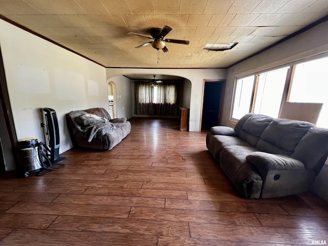 57 W 3rd St, New Burnside, IL 62967 - living room with ornamental molding, arched walkways, a ceiling fan, and hardwood / wood-style floors
