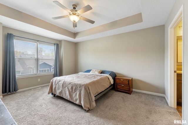 4743 Pheasant Creek Ave, Davenport, IA 52807 - carpeted bedroom featuring visible vents, a ceiling fan, baseboards, and a tray ceiling