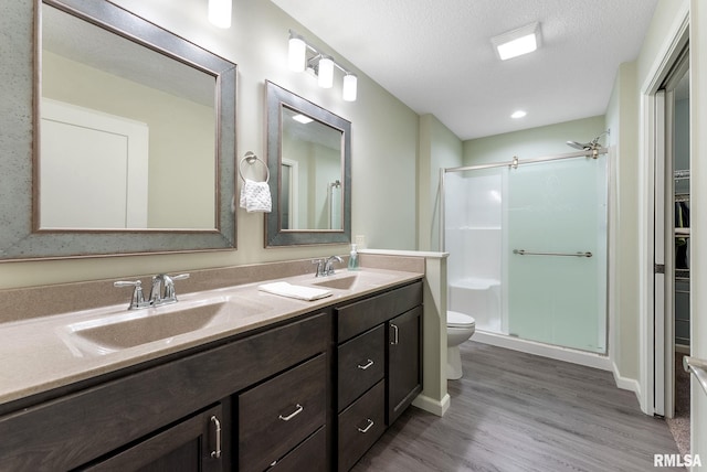 4743 Pheasant Creek Ave, Davenport, IA 52807 - full bath with a shower stall, wood finished floors, and a sink