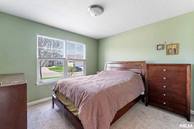4743 Pheasant Creek Ave, Davenport, IA 52807 - carpeted bedroom with baseboards and a textured ceiling