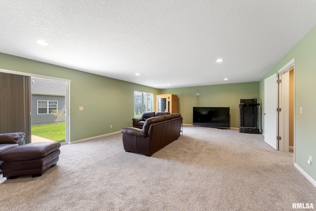 4743 Pheasant Creek Ave, Davenport, IA 52807 - carpeted living area with baseboards, a textured ceiling, and recessed lighting