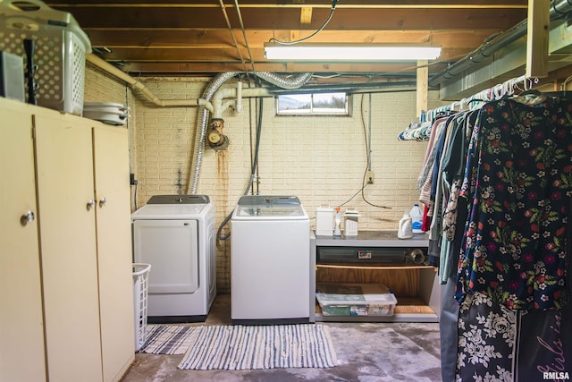 3122 Gross Gables St, Quincy, IL 62305 - laundry area with washer and dryer, brick wall, and laundry area