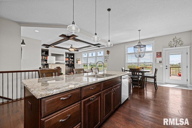 kitchen with dark wood-style flooring, ceiling fan, stainless steel dishwasher, and a sink