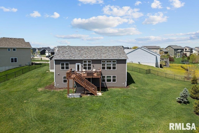 back of property featuring a deck, stairs, a residential view, and a fenced backyard