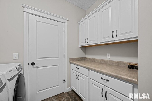 clothes washing area featuring separate washer and dryer, cabinet space, and dark wood finished floors