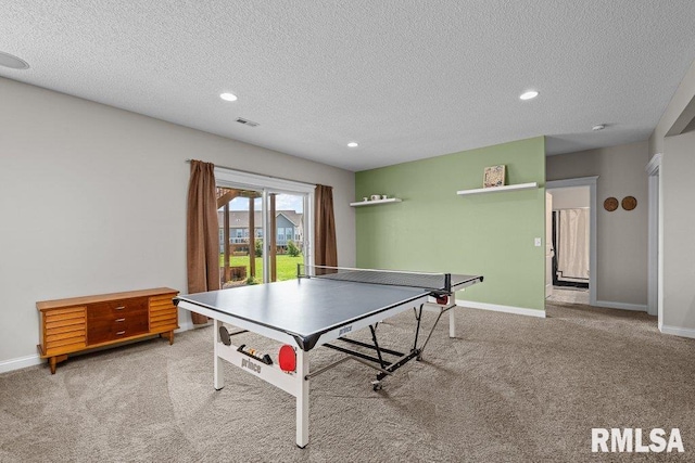 recreation room featuring recessed lighting, a textured ceiling, carpet floors, and baseboards