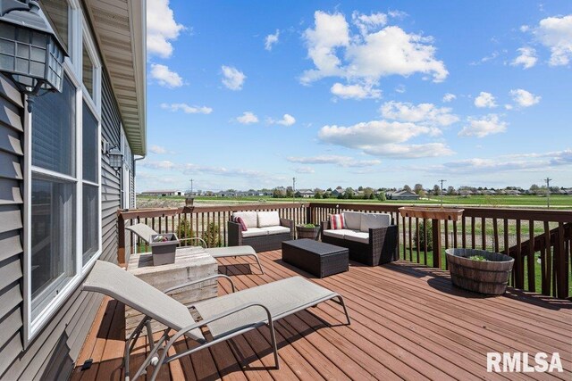 deck featuring outdoor lounge area