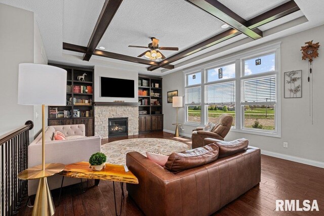 living room featuring coffered ceiling, ceiling fan, baseboards, beam ceiling, and dark wood-style floors