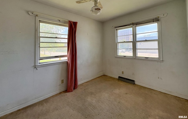 715 31st Ave, Rock Island, IL 61201 - empty room featuring carpet, baseboards, and a baseboard radiator