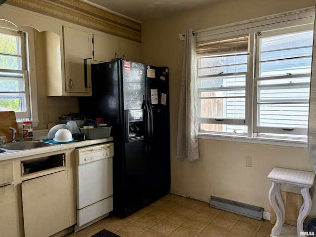715 31st Ave, Rock Island, IL 61201 - kitchen featuring dishwasher, a baseboard radiator, black fridge, light countertops, and a sink
