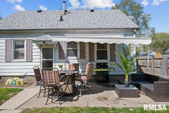 1117 S Ohio Ave, Davenport, IA 52802 - rear view of property with fence, an outdoor living space, a patio, and a shingled roof