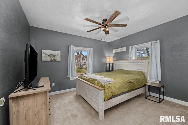 1117 S Ohio Ave, Davenport, IA 52802 - bedroom featuring a textured wall, baseboards, and light colored carpet
