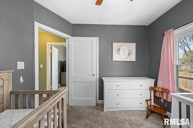 1117 S Ohio Ave, Davenport, IA 52802 - carpeted bedroom with baseboards and a ceiling fan