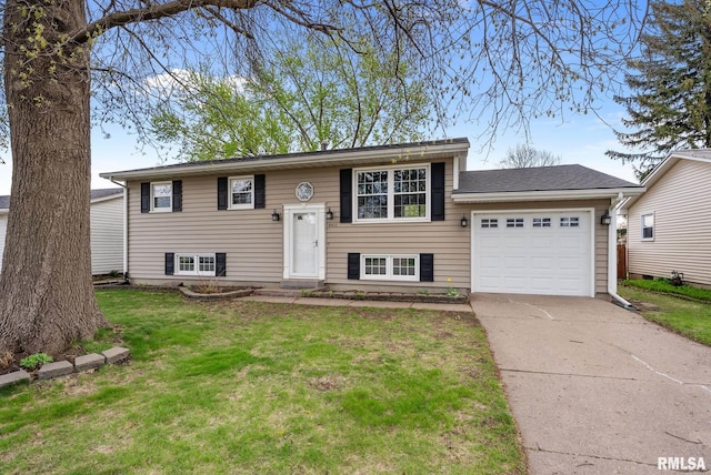 6411 Cedar St, Davenport, IA 52806 - raised ranch with an attached garage, concrete driveway, and a front yard