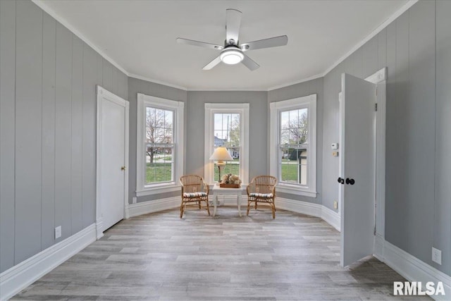 608 S Oakwood Ave, Geneseo, IL 61254 - sitting room with ornamental molding, light wood-style floors, a ceiling fan, and baseboards