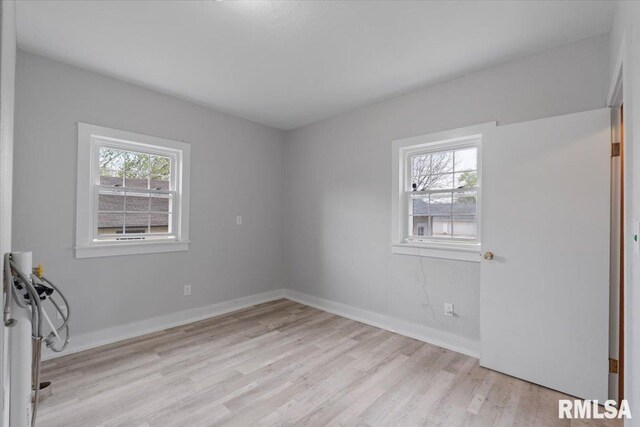 608 S Oakwood Ave, Geneseo, IL 61254 - spare room with light wood-style floors and baseboards