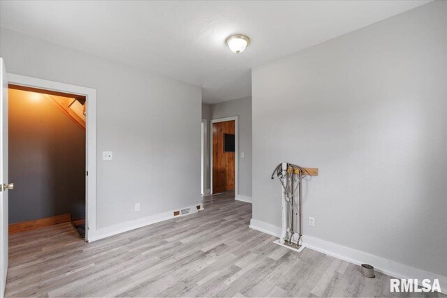 608 S Oakwood Ave, Geneseo, IL 61254 - spare room with light wood-style flooring and baseboards