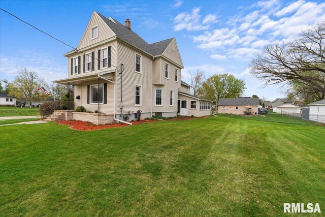 608 S Oakwood Ave, Geneseo, IL 61254 - rear view of house with a chimney and a porch