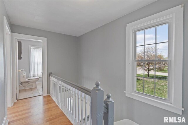 608 S Oakwood Ave, Geneseo, IL 61254 - hallway with an upstairs landing and light wood-type flooring