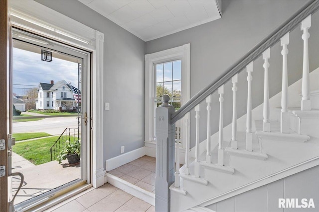 608 S Oakwood Ave, Geneseo, IL 61254 - entryway with tile patterned floors, stairway, and baseboards