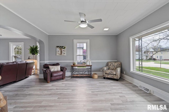 608 S Oakwood Ave, Geneseo, IL 61254 - sitting room with a ceiling fan, healthy amount of natural light, arched walkways, and light wood finished floors
