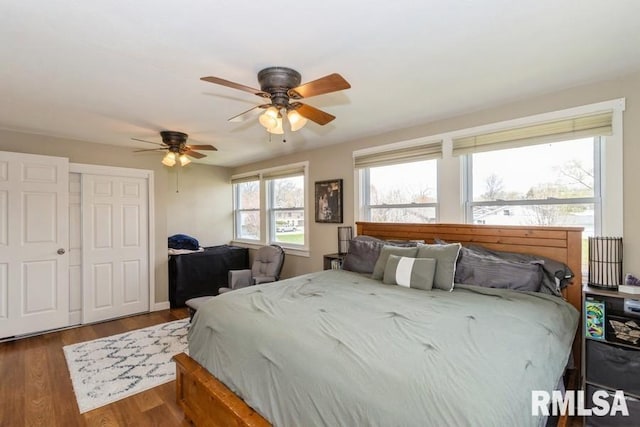 bedroom with ceiling fan and wood finished floors