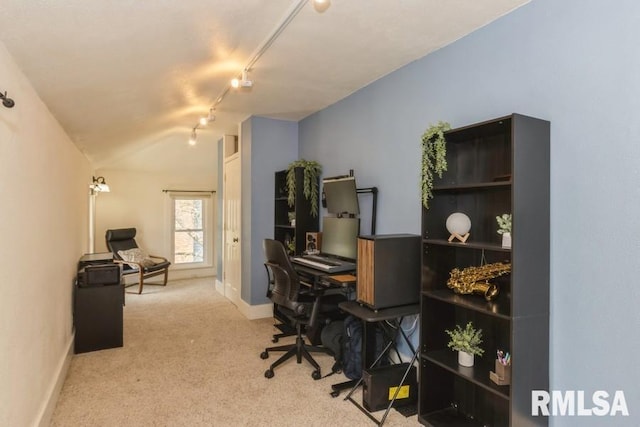 office with lofted ceiling, baseboards, track lighting, and carpet flooring